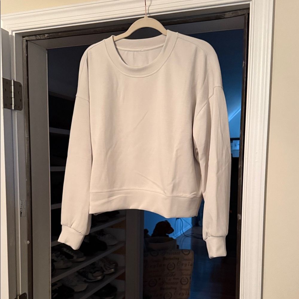 New without tags lululemon softstreme Sweatshirt. Size 8. Bone